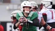 Louisville Miller Moss (7) runs and then throws the ball against Red Louisville in the Spring Game Friday night at L & N Stadium.
April 11, 2025