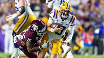 Tigers Quarterback Garrett Nussmeier 18 scrambles and is sacked by Linebacker Jaiden Bracker 15