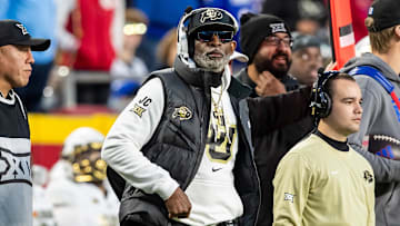 Nov 23, 2024; Kansas City, Missouri, USA;  Colorado head coach Deion Sanders watches the run of play during the 3rd quarter between the Kansas Jayhawks and the Colorado Buffaloes at GEHA Field at Arrowhead Stadium.