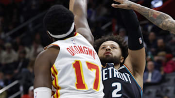 Dec 1, 2025; Detroit, Michigan, USA;  Detroit Pistons guard Cade Cunningham (2) shoots on Atlanta Hawks forward Onyeka Okongwu (17) in the second half at Little Caesars Arena. Mandatory Credit: Rick Osentoski-Imagn Images