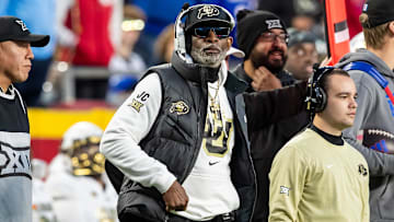 Nov 23, 2024; Kansas City, Missouri, USA;  Colorado head coach Deion Sanders watches the run of play during the 3rd quarter between the Kansas Jayhawks and the Colorado Buffaloes at GEHA Field at Arrowhead Stadium. Mandatory Credit: Nick Tre. Smith-Imagn Images