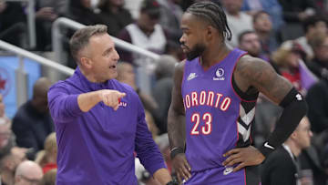 Nov 2, 2024; Toronto, Ontario, CAN; Toronto Raptors head coach Darko Rajakovic talks to guard Jamal Shead (23) during a break in the action against the Sacramento Kings during the second half at Scotiabank Arena. Mandatory Credit: John E. Sokolowski-Imagn Images