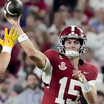 Nov 8, 2025; Tuscaloosa, Alabama, USA;  Alabama quarterback Ty Simpson (15) throws a pass that was deflected and was eventually caught by Alabama offensive lineman Wilkin Formby (75) at Saban Field at Bryant-Denny Stadium. Alabama defeated LSU 20-9. Mandatory Credit: Gary Cosby Jr.-Imagn Images