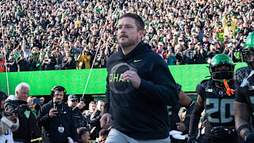 Oregon coach Dan Lanning leads his team onto the field for their game against Southern California Nov. 22, 2025.