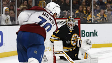 Oct 25, 2025; Boston, Massachusetts, USA; Boston Bruins goaltender Jeremy Swayman (1) eyes a shot by Colorado Avalanche defenseman Sam Malinski (70) during the third period at TD Garden. Mandatory Credit: Winslow Townson-Imagn Images