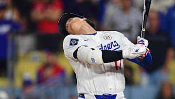 Sep 15, 2025; Los Angeles, California, USA; Los Angeles Dodgers designated hitter Shohei Ohtani (17) moves to avoid an inside pitch during his at bat against the Philadelphia Phillies during the ninth inning at Dodger Stadium. Mandatory Credit: Gary A. Vasquez-Imagn Images