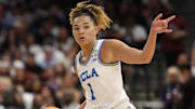 UCLA Bruins guard Kiki Rice (1) controls the ball against the Connecticut Huskies during first quarter in a semifinal of the women's 2025 NCAA tournament at Amalie Arena. Mandatory Credit: Nathan Ray Seebeck-Imagn Images