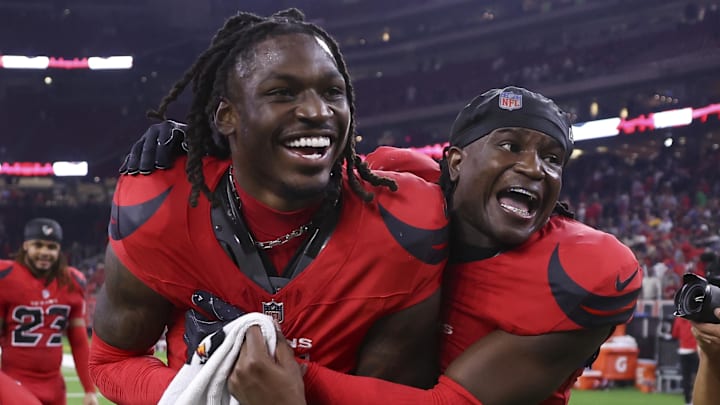 Nov 20, 2025; Houston, Texas, USA; Houston Texans cornerback Kamari Lassiter (4) and safety Calen Bullock (2) celebrate after the game against the Buffalo Bills at NRG Stadium. Mandatory Credit: Troy Taormina-Imagn Images