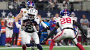 Nov 28, 2024; Arlington, Texas, USA;  Dallas Cowboys wide receiver KaVontae Turpin (9) catches a pass as New York Giants cornerback Cor'Dale Flott (28) defends during the first half at AT&T Stadium. Mandatory Credit: Chris Jones-Imagn Images