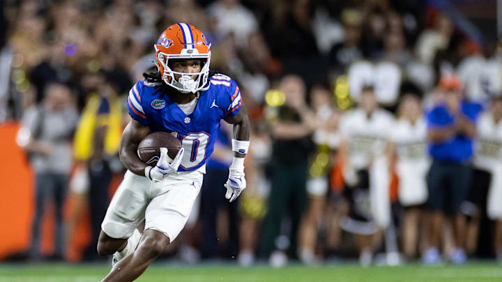 Oct 5, 2024; Gainesville, Florida, USA; Florida Gators wide receiver Tank Hawkins (10) runs with the ball against the UCF Knights during the first half at Ben Hill Griffin Stadium. Mandatory Credit: Matt Pendleton-Imagn Images