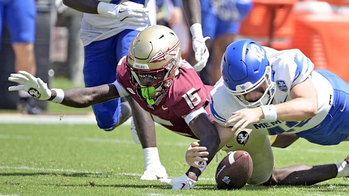 Sep 14, 2024; Tallahassee, Florida, USA; Memphis Tigers defensive back Harold Stubbs IV (42) recovers a fumbled punt return by Florida State Seminoles wide receiver Lawayne McCoy (15) during the first half at Doak S. Campbell Stadium. Mandatory Credit: Melina Myers-Imagn Images