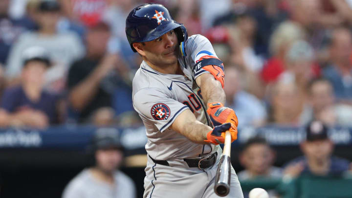 Aug 27, 2024; Philadelphia, Pennsylvania, USA; Houston Astros second base Jose Altuve (27) hits a single against the Philadelphia Phillies during the third inning at Citizens Bank Park.