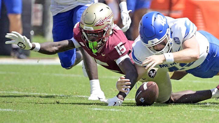 Sep 14, 2024; Tallahassee, Florida, USA; Memphis Tigers defensive back Harold Stubbs IV (42) recovers a fumbled punt return by Florida State Seminoles wide receiver Lawayne McCoy (15) during the first half at Doak S. Campbell Stadium. Mandatory Credit: Melina Myers-Imagn Images