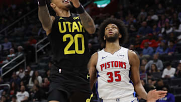 Dec 21, 2023; Detroit, Michigan, USA;  Utah Jazz forward John Collins (20) shoots on Detroit Pistons Marvin Bagley III