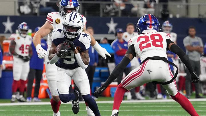 Nov 28, 2024; Arlington, Texas, USA;  Dallas Cowboys wide receiver KaVontae Turpin (9) catches a pass as New York Giants cornerback Cor'Dale Flott (28) defends during the first half at AT&T Stadium. Mandatory Credit: Chris Jones-Imagn Images