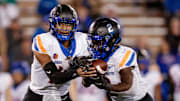  Boise State Broncos quarterback Taylen Green (10) hands the ball off to running back Ashton Jeanty (2) in the second quarter against the Air Force Falcons at Falcon Stadium.