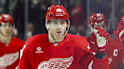 Mar 27, 2025; Detroit, Michigan, USA;  Detroit Red Wings right wing Patrick Kane (88) is congratulated by teammates after scoring in the third period against the Ottawa Senators at Little Caesars Arena. Mandatory Credit: Rick Osentoski-Imagn Images