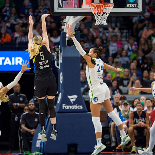 Dallas Wings guard Paige Bueckers (5) shoots over the defense of Minnesota Lynx forward Napheesa Collier