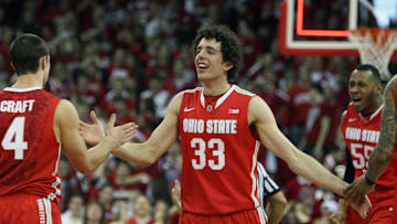 Feb 1, 2014; Madison, WI, USA; Ohio State Buckeyes guard Amedeo Della Valle (33) celebrates his team's victory over the Wisconsin Badgers  at the Kohl Center. Ohio State defeated Wisconsin 59-58. Mandatory Credit: Mary Langenfeld-Imagn Images