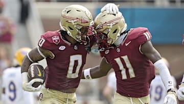 Oct 11, 2025; Tallahassee, Florida, USA; Florida State Seminoles safety Earl Little Jr. (0) and defensive back Ja'Bril Rawls (11) celebrate after an interception during the first half of the game against the Pittsburgh Panthers at Doak S. Campbell Stadium. Mandatory Credit: Melina Myers-Imagn Images