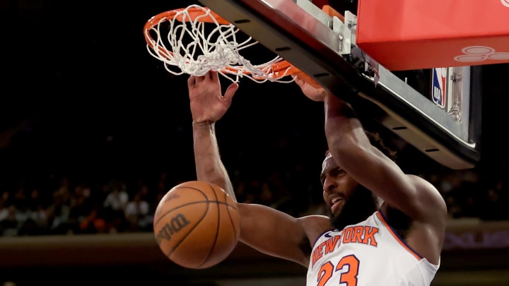 Oct 14, 2022; New York, New York, USA; New York Knicks center Mitchell Robinson (23) dunks against the Washington Wizards during the fourth quarter at Madison Square Garden. Mandatory Credit: Brad Penner-USA TODAY Sports