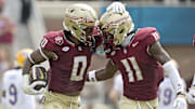 Oct 11, 2025; Tallahassee, Florida, USA; Florida State Seminoles safety Earl Little Jr. (0) and defensive back Ja'Bril Rawls (11) celebrate after an interception during the first half of the game against the Pittsburgh Panthers at Doak S. Campbell Stadium. Mandatory Credit: Melina Myers-Imagn Images