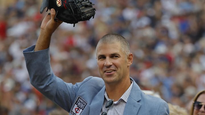 Aug 5, 2023; Minneapolis, Minnesota, USA; 2023 member of the Minnesota Twins hall of fame class Joe Mauer salutes the fans in a pre-game ceremony before the match with the Arizona Diamondbacks at Target Field. Mandatory Credit: Bruce Kluckhohn-USA TODAY Sports