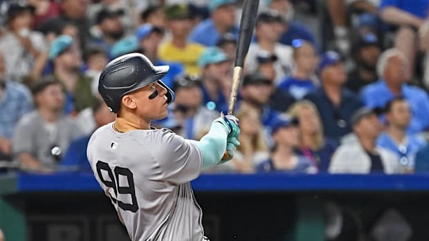 Jun 11, 2024; Kansas City, Missouri, USA; New York Yankees center fielder Aaron Judge (99) hits a two-run home run in the seventh inning against the Kansas City Royals at Kauffman Stadium. Mandatory Credit: Peter Aiken-USA TODAY Sports