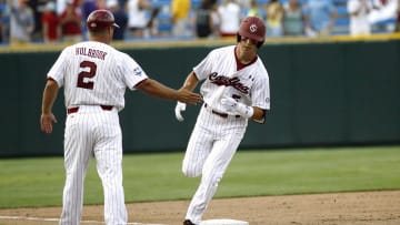 South Carolina baseball legend Whit Merrifield rounding third base after hitting a home run in the 2010 College World Series