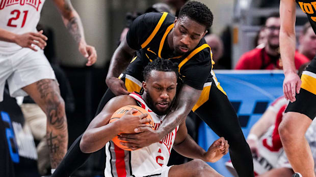 Iowa Hawkeyes forward Seydou Traore (7) attempts to grab the ball from Ohio State Buckeyes guard Bruce Thornton (2) on Wednes