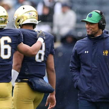 Notre Dame Head Coach Marcus Freeman, right, watches cornerback Isaiah Dunn (26) console quarterback Kenny Minchey (8) during the Notre Dame Blue-Gold Spring Football game on Saturday, April 22, 2023, at Notre Dame Stadium in South Bend