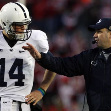 Former Penn State Nittany Lions coach Bill O'Brien talks to quarterback Christian Hackenberg during a 2013 game against the Wisconsin Badgers at Camp Randall Stadium.