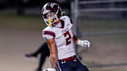 Jenks’ Kaydin Jones (2) runs the ball for a touchdown during a high school football game between Mustang and Jenks in Mustang, Okla., on Friday, Oct. 11, 2024.