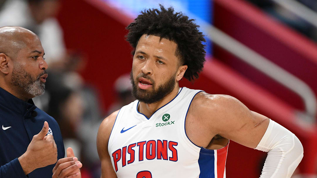 Mar 12, 2026; Detroit, Michigan, USA;  Detroit Pistons head coach J.B. Bickerstaff talks with Pistons guard Cade Cunningham (2) during a break in the action against the Philadelphia 76ers in the first half at Little Caesars Arena. Mandatory Credit: Lon Horwedel-Imagn Images