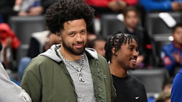Mar 23, 2025; Detroit, Michigan, USA;  Detroit Pistons players Tim Hardaway Jr. (left), Cade Cunningham (center) and Jaden Ivey (right) wa: Lon Horwedel-Imagn Images