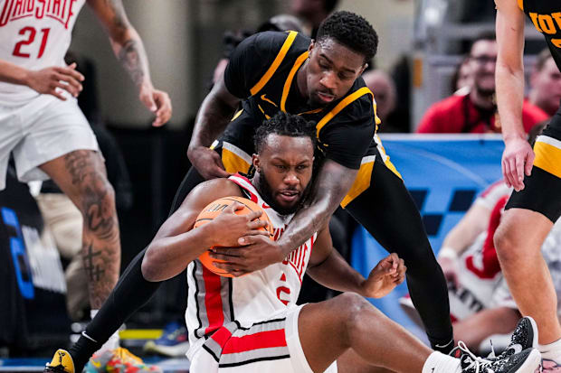 Iowa Hawkeyes forward Seydou Traore (7) attempts to grab the ball from Ohio State Buckeyes guard Bruce Thornton (2) on Wednes