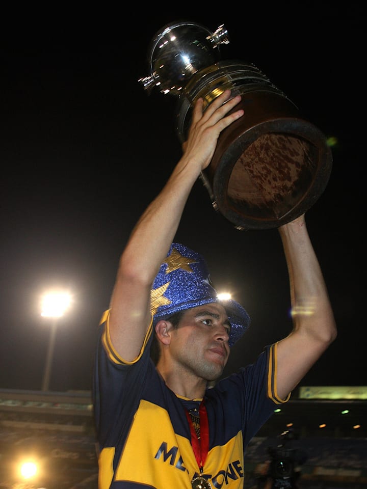 Boca Juniors' Juan Roman Riquelme holds...