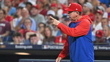 Oct 4, 2025; Philadelphia, Pennsylvania, USA; Philadelphia Phillies manager Rob Thomson (49) signals to the bullpen during the seventh inning against the Los Angeles Dodgers during game one of the NLDS round for the 2025 MLB playoffs at Citizens Bank Park.