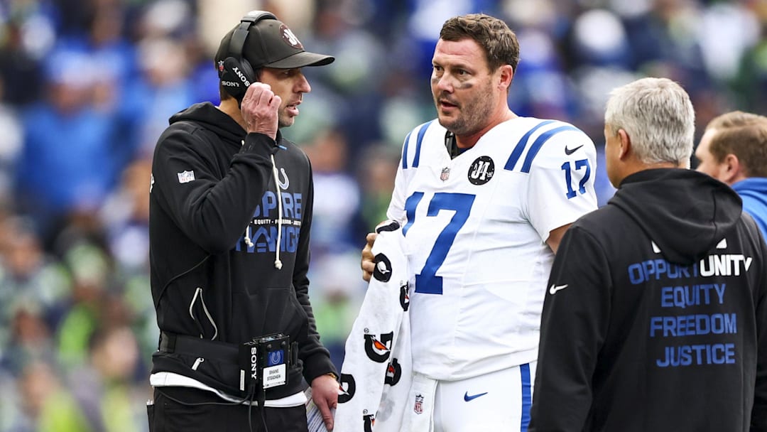 Dec 14, 2025; Seattle, Washington, USA; Indianapolis Colts head coach Shane Steichen, left, talks with quarterback Philip Rivers (17) during a second quarter timeout against the Seattle Seahawks at Lumen Field. Mandatory Credit: Kevin Ng-Imagn Images Dec 14, 2025; Seattle, Washington, USA; Indianapolis Colts head coach Shane Steichen, left, talks with quarterback Philip Rivers (17) during a second quarter timeout against the Seattle Seahawks at Lumen Field. Mandatory Credit: Kevin Ng-Imagn Images