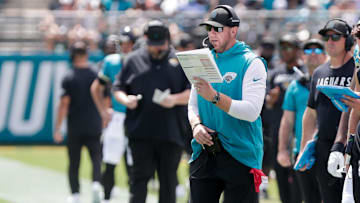 Sep 21, 2025; Jacksonville, Florida, USA; Jacksonville Jaguars head coach Liam Coen reads a play during the second quarter against the Houston Texans at EverBank Stadium. Mandatory Credit: Travis Register-Imagn Images