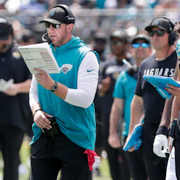 Sep 21, 2025; Jacksonville, Florida, USA; Jacksonville Jaguars head coach Liam Coen reads a play during the second quarter against the Houston Texans at EverBank Stadium. Mandatory Credit: Travis Register-Imagn Images