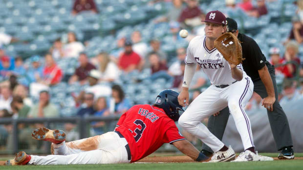 MIssissippi State's Hunter Hines (44) waits for the throw from the pitcher as Ole Miss' Andrew Fischer (3) is safe at first at Trustmark Park in Pearl, Miss., Wednesday, May 1, 2024.