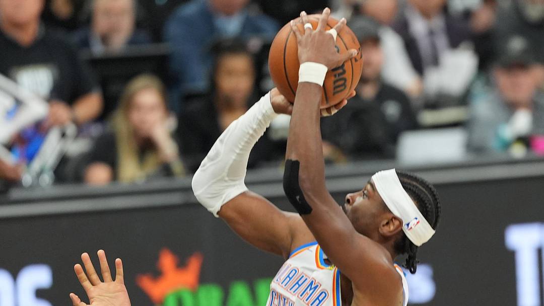 May 28, 2026; San Antonio, Texas, USA; Oklahoma City Thunder guard Shai Gilgeous-Alexander (2) shoots the ball past San Antonio Spurs forward Keldon Johnson (3) in the first half during game six of the western conference finals for the 2026 NBA playoffs at Frost Bank Center. Mandatory Credit: Daniel Dunn-Imagn Images