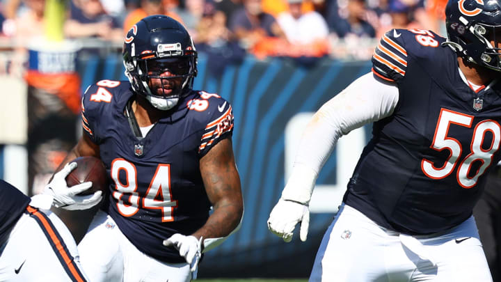 Bears 40-year-old tight end Marcedes Lewis makes a catch and turns upfield on a screen against Denver last season.