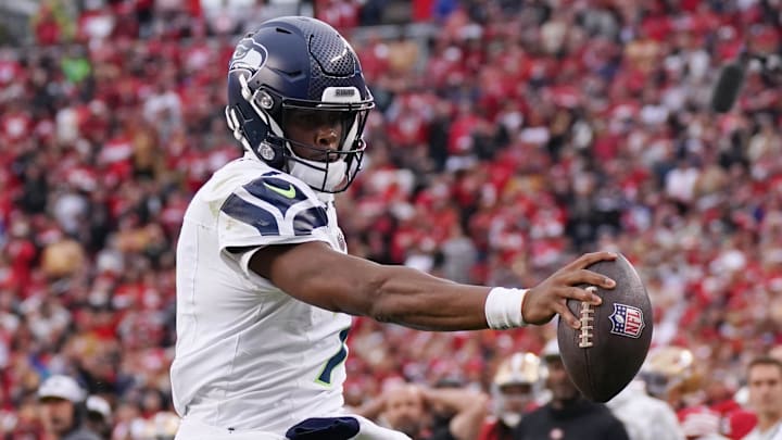 Nov 17, 2024; Santa Clara, California, USA; Seattle Seahawks quarterback Geno Smith (7) scores a rushing touchdown past San Francisco 49ers cornerback Isaac Yiadom (22) to win the game in the fourth quarter at Levi's Stadium. Nov 17, 2024; Santa Clara, California, USA; Seattle Seahawks quarterback Geno Smith (7) scores a rushing touchdown past San Francisco 49ers cornerback Isaac Yiadom (22) to win the game in the fourth quarter at Levi's Stadium.