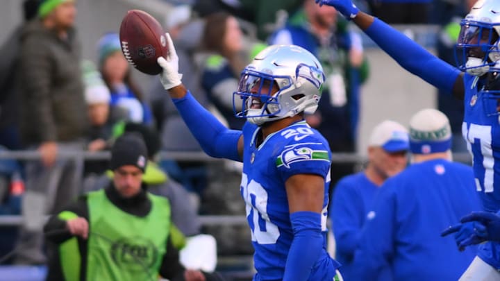 Oct 29, 2023; Seattle, Washington, USA; Seattle Seahawks safety Julian Love (20) celebrates after intercepting the ball against the Cleveland Browns during the second half at Lumen Field. Mandatory Credit: Steven Bisig-Imagn Images