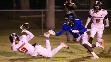 Hawthorne Hornets Terrell James (3) almost intercepts a pass intended for Wildwood Wildcats Vernell