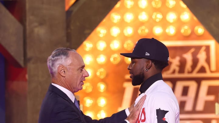 Jul 14, 2024; Ft. Worth, TX, USA;  MLB Commissioner Rob Manfred takes a photo with Kaelen Culpepper after he was drafted by the Minnesota Twins with the 21st pick during the first round of the MLB Draft at Cowtown Coliseum. Mandatory Credit: Kevin Jairaj-USA TODAY Sports