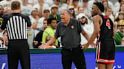 Houston coach Kelvin Sampson (center) and guard LJ Cryer (right) react to a call during the Cougars' win at Baylor on March 8, 2025.