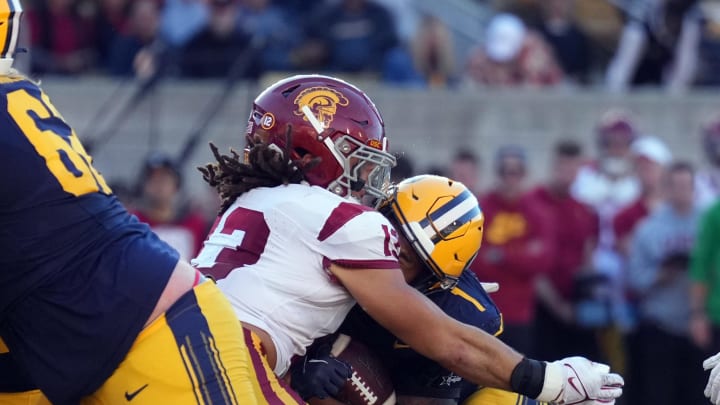 Oct 28, 2023; Berkeley, California, USA; USC Trojans linebacker Mason Cobb (left) tackles California Golden Bears running back Jaydn Ott (right) during the fourth quarter at California Memorial Stadium. Mandatory Credit: Darren Yamashita-USA TODAY Sports